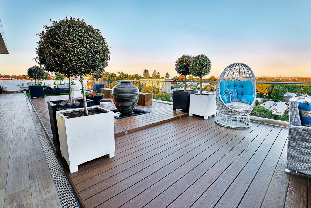 Photo of a deck attached to a penthouse | Featured image for NewTechwood Decking.